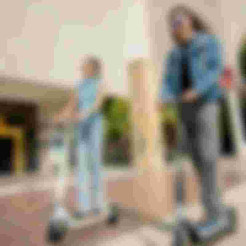 couple riding scooters